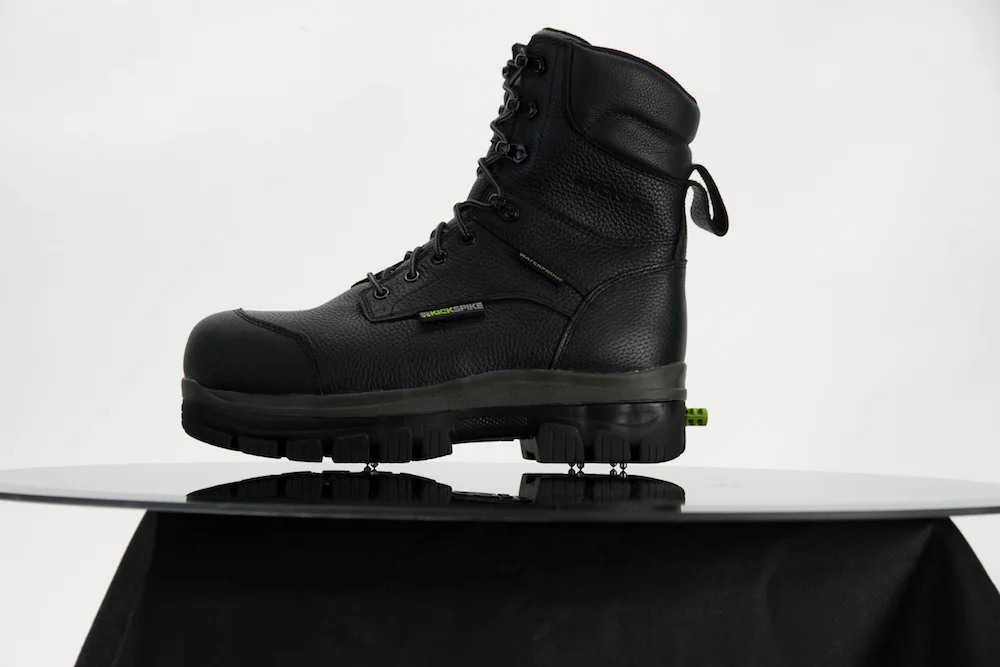 Kickspike GEN II REBEL II in black, 8 inch profile, spikes deployed below the outsole